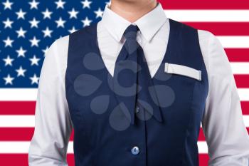 Service woman uniform, closeup photo on a USA flag background
