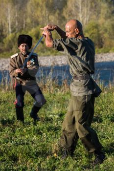 CHARISHSKOE. ALTAISKIY KRAI. WESTERN SIBERIA. RUSSIA - SEPTEMBER 15, 2016: descendants of the Cossacks in the Altai, cossack with a saber at the festival on September 15, 2016 in Altayskiy krai, Siberia, Russia.