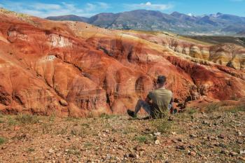 Man in Valley of Mars landscapes in the Altai Mountains, Russia