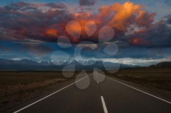 Empty route in Altai mountains with beauty sunset
