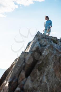 Domestic tourism, travel, lesure and freedom concept after pandemic- woman on the top of Altai mountain, beauty summer evening landcape