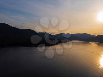 Sunset on Teletskoye lake in Altai mountains, Siberia, Russia. Drone shot.