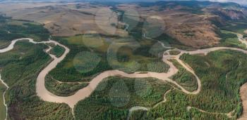 Kurai steppe and Chuya river on North-Chui ridge background. Altai mountains, Russia. Aerial drone panoramic picture.