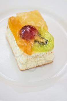 Piece of Fruit cake in a white plate