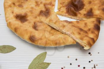 Ossetian baked pie with cheese and salmon fish