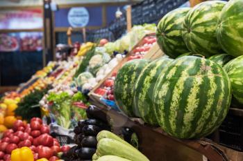 Ripe watermelons in farmer market: fresh organic healthy watermelons at grocery store.