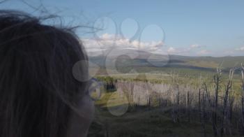 Woman on the top of mountain, Seminsky mountain pass, Altai mountains. Beauty summer sunny evening/ Concept of relaxing in the mountains or traveling