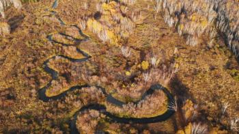 Aerial drone video of autumn landscape with river.