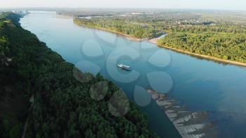 Aerial view of big siberian Ob river and ship in beauty summer day, View to Barnaul city. 4K drone footage.