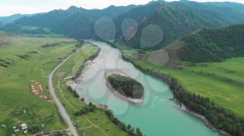 Mountain river Katun and green egg shaped island into the river, green valley, beauty summer evening, Altai mountains