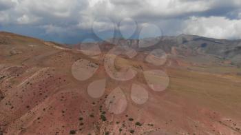 Aerial drone 4K video of colorful eroded landform of Altai mountains. Amazing nature landscape called Mars, near the border with Mongolia, Chagan-Uzun, Altai Republic, Russia