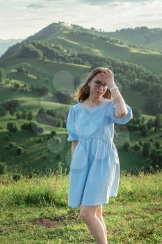 Woman in blue dress in Altai mountain, beauty summer landcape, travel, lesure concept