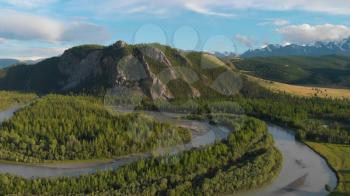 Kurai steppe and Chuya river on North-Chui ridge mountains background. Altai mountains, Russia. Aerial drone 4k video.