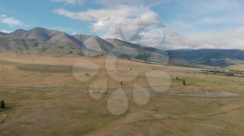 Aerial video of the Kurai steppe and the North Chuia Ranges in the south-eastern Altai, Siberia, Russia