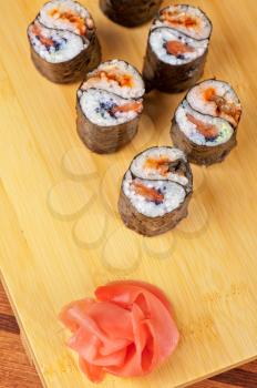 Japanese cuisine - sushi rolls with tobico and pancake