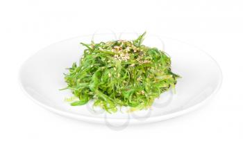 seaweed salad served with sesame on a white