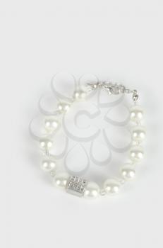 Pearl bracelet on white background