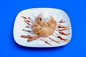 apple strudel with ice cream at blue background