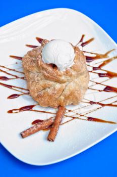 apple strudel with ice cream at blue background