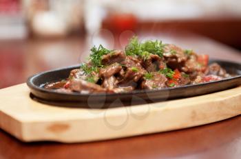 meat with vegetables at frying pan