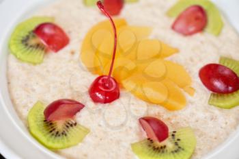 Tasty oatmeal with berries and fruits
