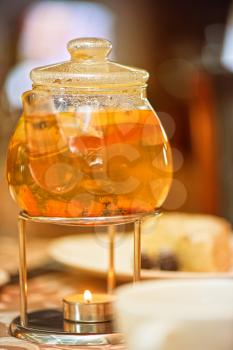 teapot of herbal tea on table 