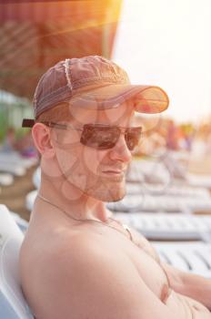 Man at the summer beach, closeup portrait