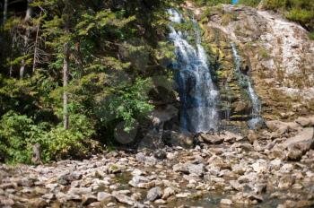 Waterfall in summer siberian forest