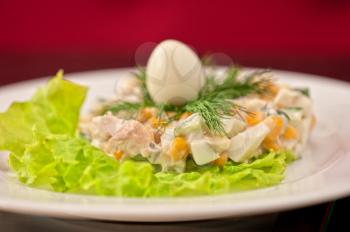 Salad from chicken breast, vegetable, mayoneese and quail egg