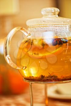 teapot of herbal tea on table 