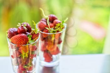 Fresh ripe strawberry in a glass