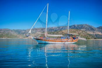 yacht on bay and castle in Kekova, near ruins of the ancient city on the Kekova island, Turkey