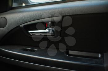 Closeup shot of button locking doors in car. not closed door in car.
