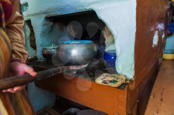 Cooking meals in a Russian stove, soup with meat and groats