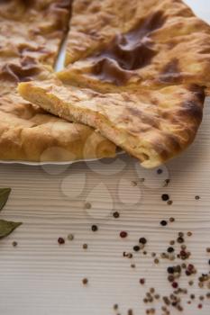 Ossetian baked pie with cheese and salmon fish