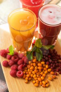 set of fruit non-alcoholic drink with cranberries raspberries and sea buckthorn