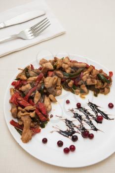 Salad with chicken and vegetables with cranberries