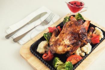 Roasted chicken with vegetables. Thanksgiving or christmas theme.