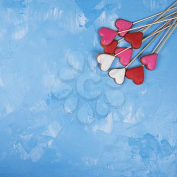 Gingerbreads for Valentines Day or Marriage on blue concrete background