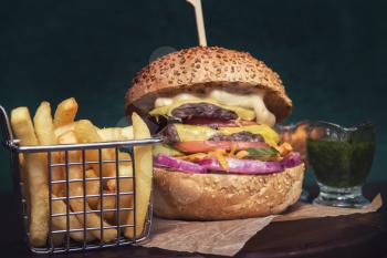 Tasty classical burger with fried potato