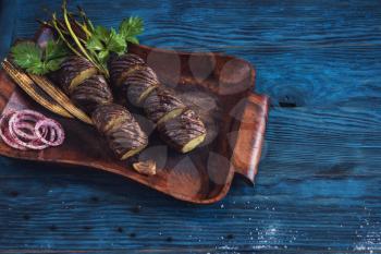 Grilled potato on a blue wooden background