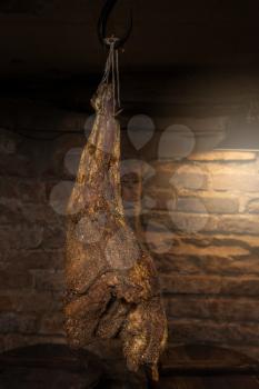 Domestic smoked meat produced in the dark basement