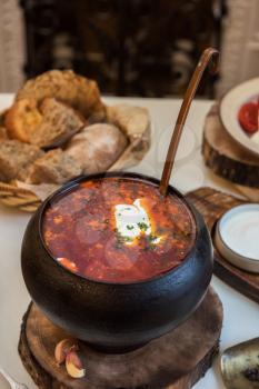 Russian borsch at pot on the table