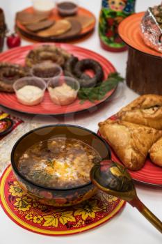 Table with traditional russian food decorated in russian style