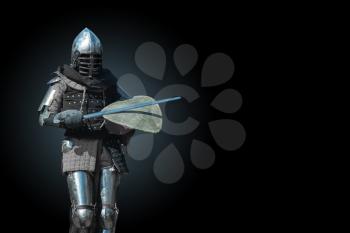 Knight in armour on a dark background
