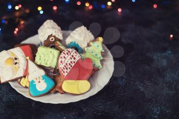 Christmas cookies on dark background with bokeh lights