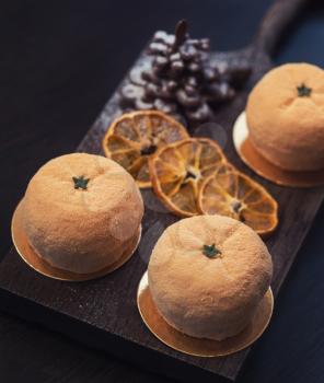 Tasty dessert as orange fruit with chocolate fir-tree