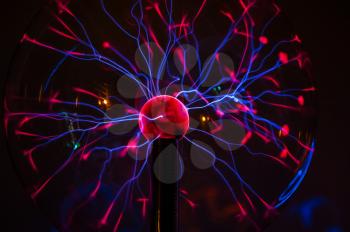 Electric plasma in glass sphere, concept for science, power, electricity, or physics