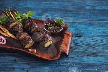 Grilled potato on a blue wooden background