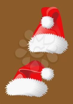 Two red christmas hats of Santa Claus for holiday design